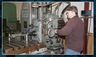 Machinist operating a turning center at Iowa Tool & Manufacturing